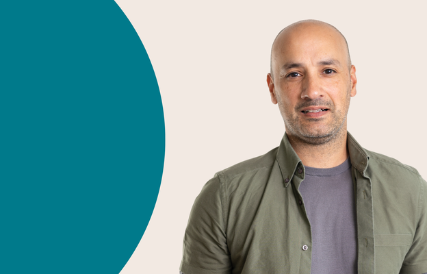 A horizontal banner that shows Trust for London ceo Manny Hothi. To his right is a large green semi circle, representing Trust for London's brand colours.